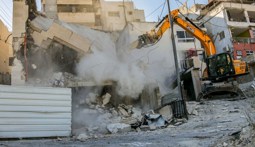 Demolishing Muslim homes with British machinery Demolishing Muslim homes with British machinery