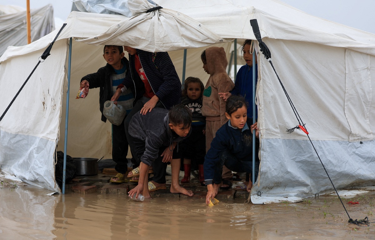 A humanitarian disaster unfolding: Gaza flooded, freezing, and cut off from aid