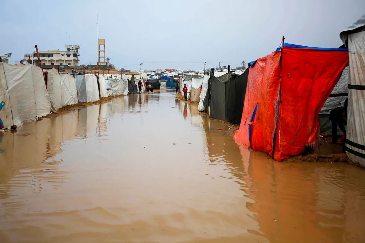 A humanitarian disaster unfolding: Gaza flooded, freezing, and cut off from aid