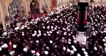 اقامه نماز بر پیکر مطهر امام شهید حضرت آیت‌الله سیّدعلی خامنه‌ای توسط آیت‌الله حکیم در حرم مطهر امیرالمومنین (ع)