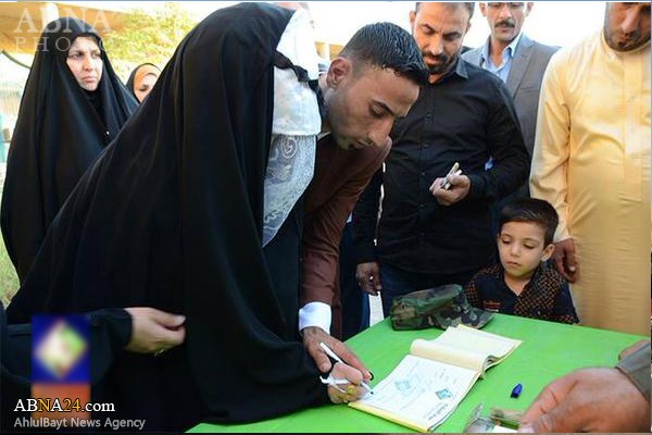 تقدیر زوج عراقی از رزمندگان حشد شعبی + عکس تقدیر زوج عراقی از رزمندگان حشد شعبی + عکس